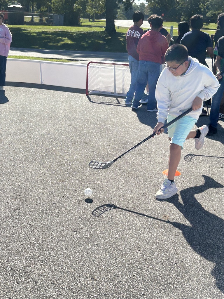 CFM After School enjoyed a visit from the UNCW men's hockey team head coach and the Wilmington Arena Project! Students learned about ball hockey, practiced their skills, and put them to the test.
