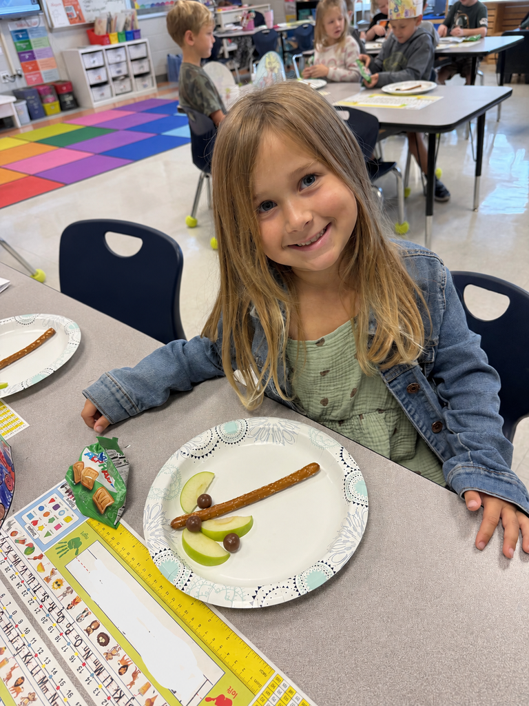 student eating a chicka chicka boom boom snack