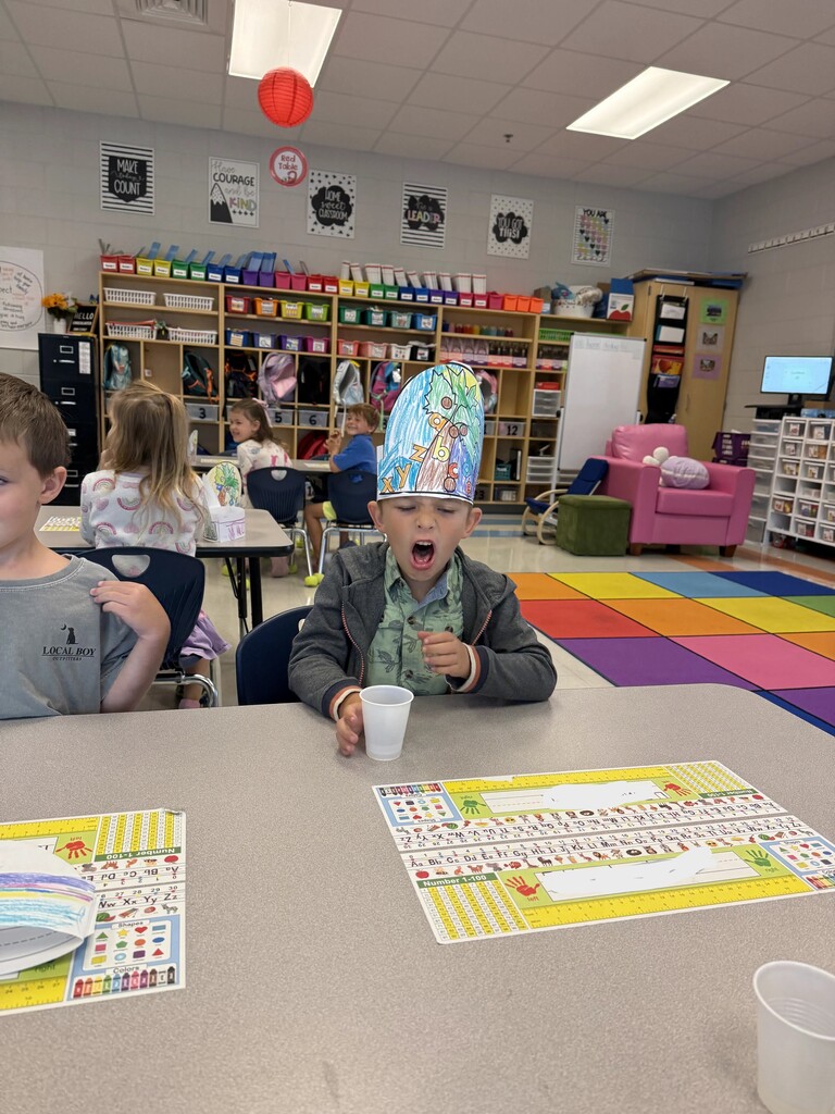 kindergarten student tasting coconut water