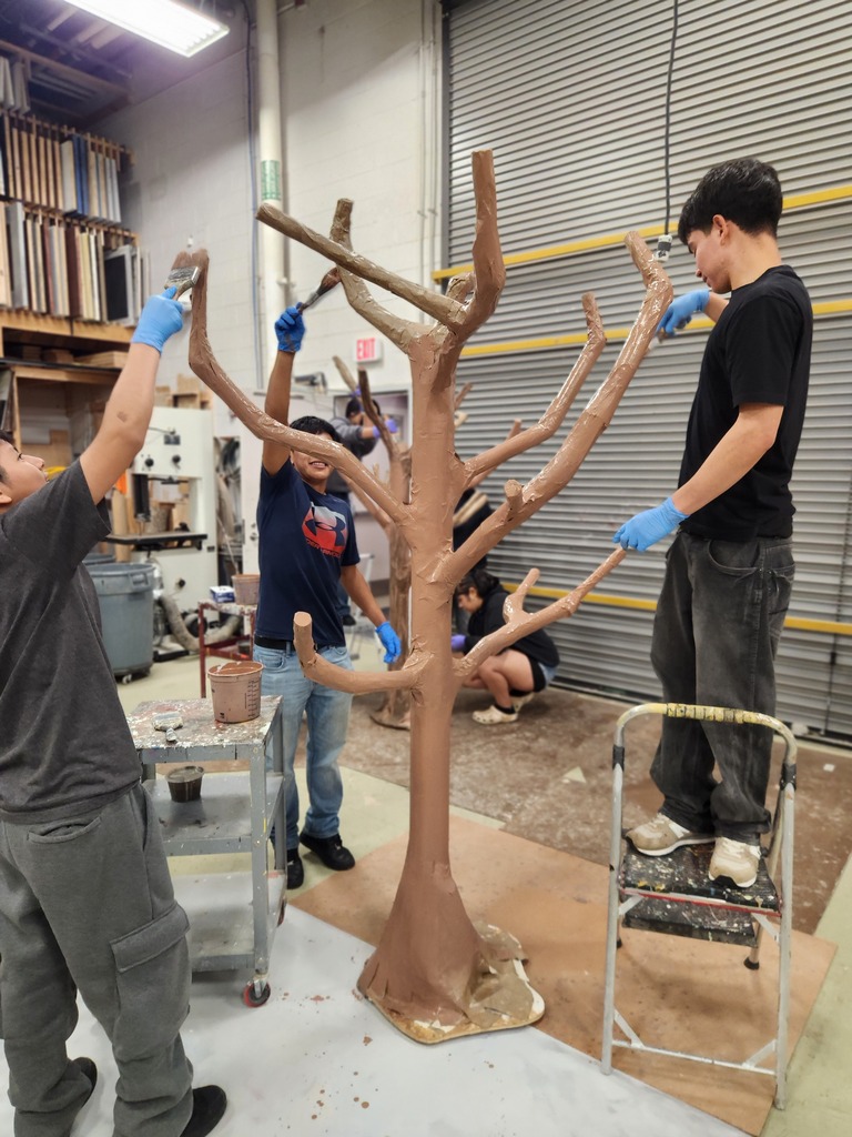 students working on tree for hispanic heritage display