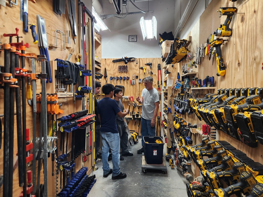 students working with UNCW professor in tool area