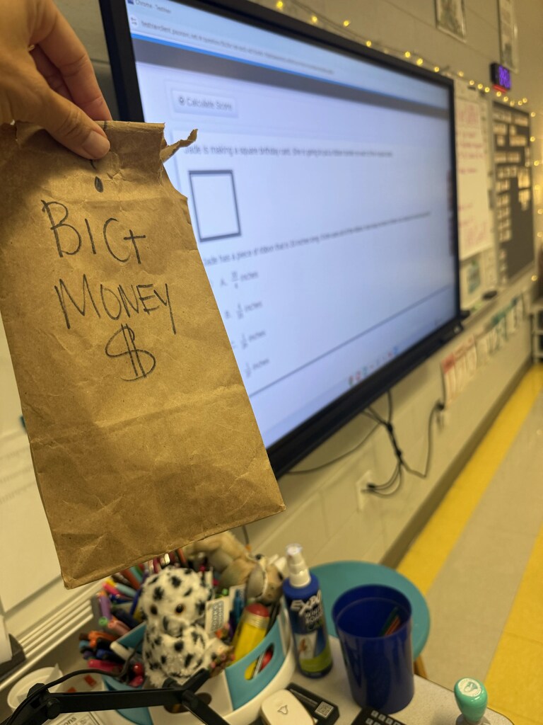 brown lunch bag that says big money