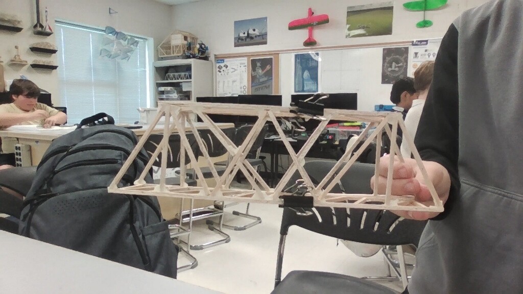 In 7th grade Engineering, it is finally testing day for their balsa wood bridges! So far we have one that held 61 lbs. and another that held 59 lbs!