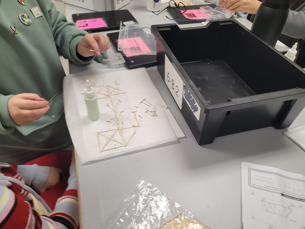 In 6th grade Engineering, the kids are working hard on building their toothpick bridges! They are looking forward to testing them to see whose is the strongest.