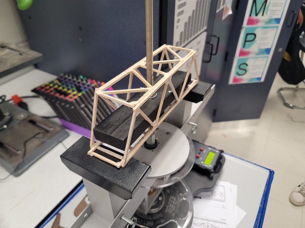 In 7th grade Engineering, it is finally testing day for their balsa wood bridges! So far we have one that held 61 lbs. and another that held 59 lbs!