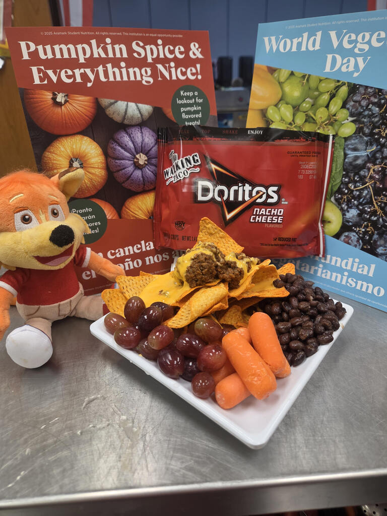 Walkin Taco display plate with beans, carrots, and grapes