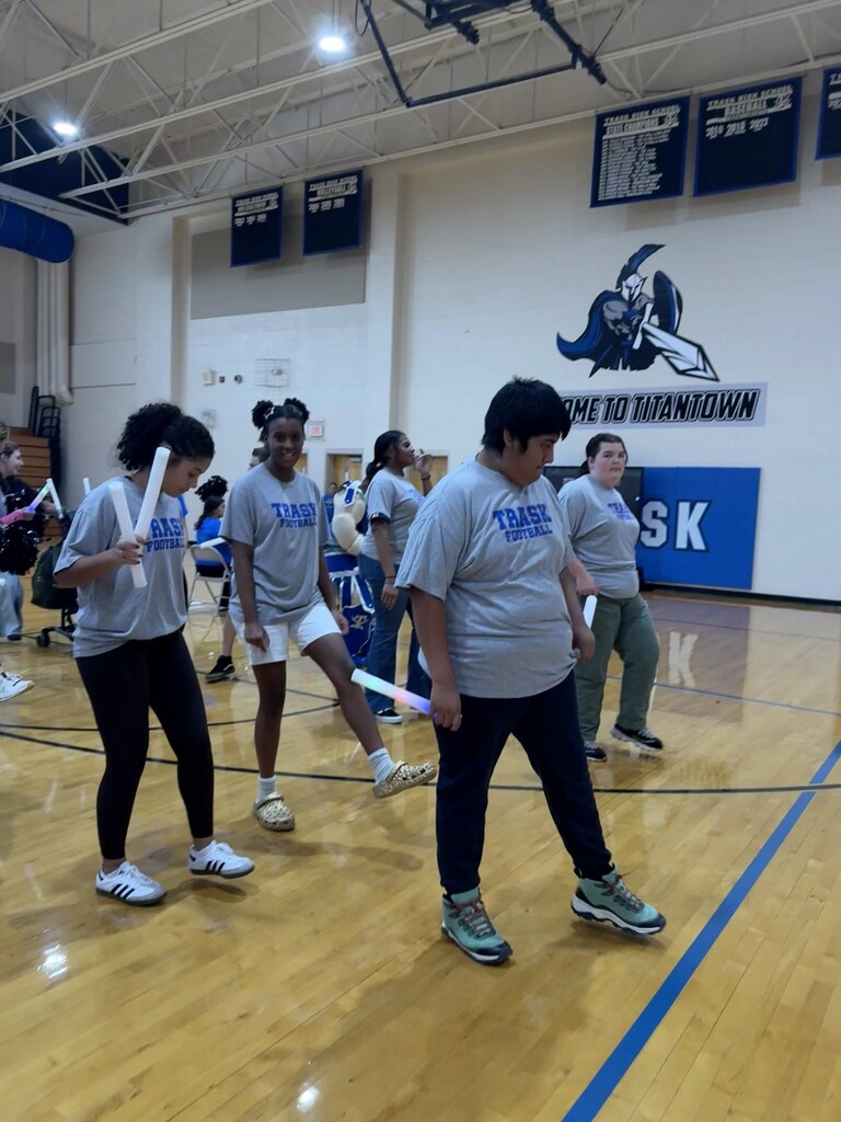 students dancing on gym floor