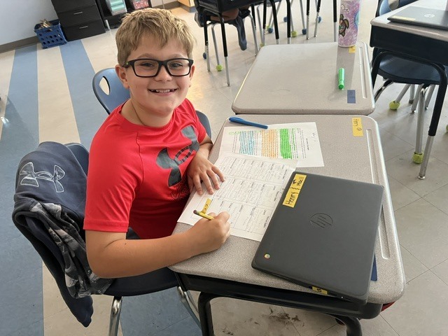 4th grade students working in groups on an assignment