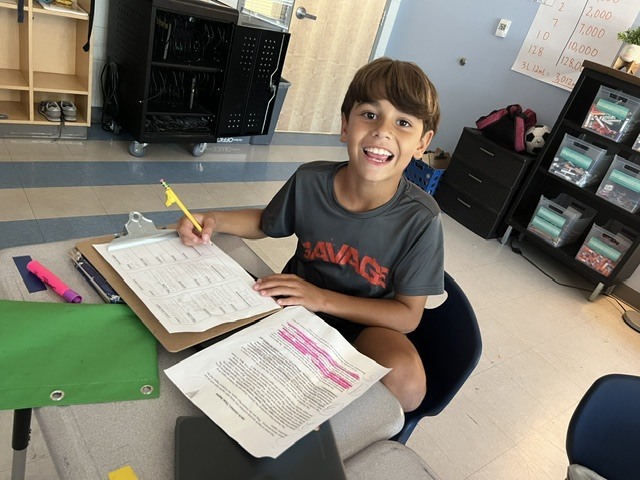 4th grade students working in groups on an assignment