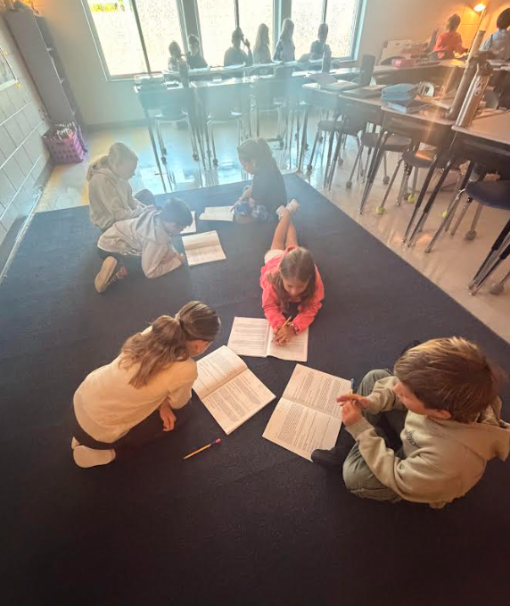 4th grade students working in groups on an assignment