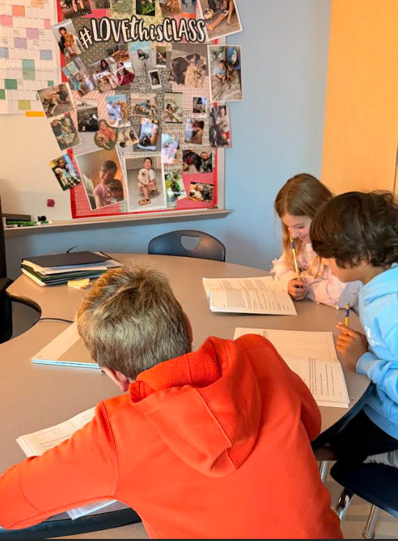 4th grade students working in groups on an assignment