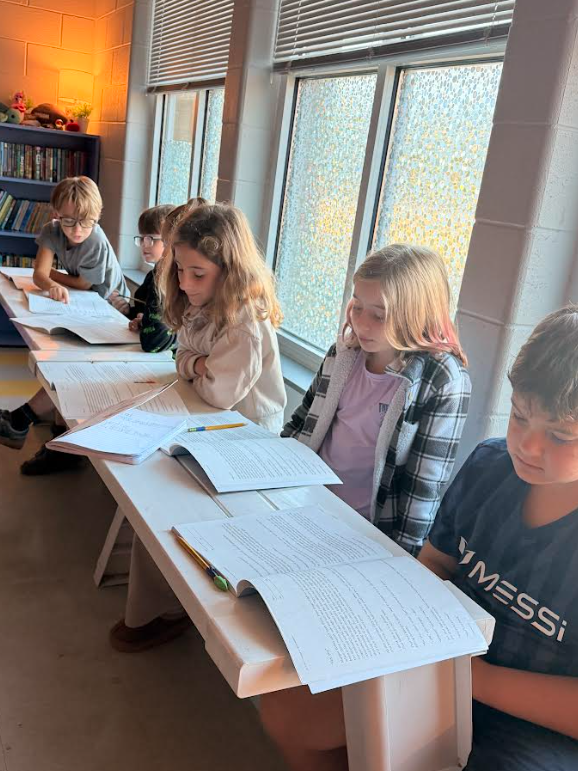 4th grade students working in groups on an assignment