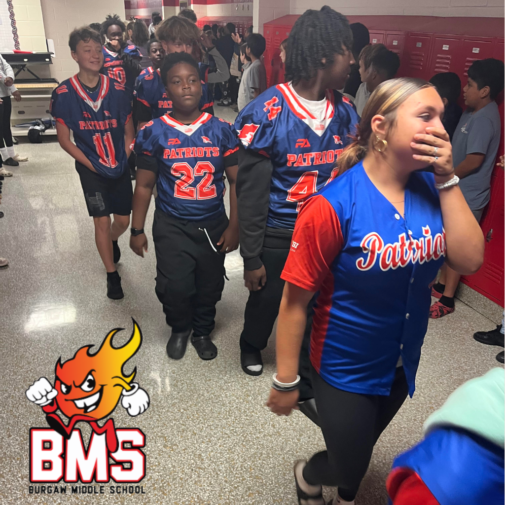 students in hallway during sports celebration