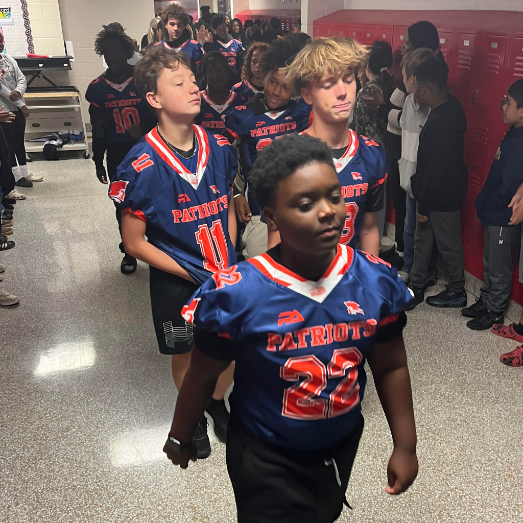 students in hallway during sports celebration