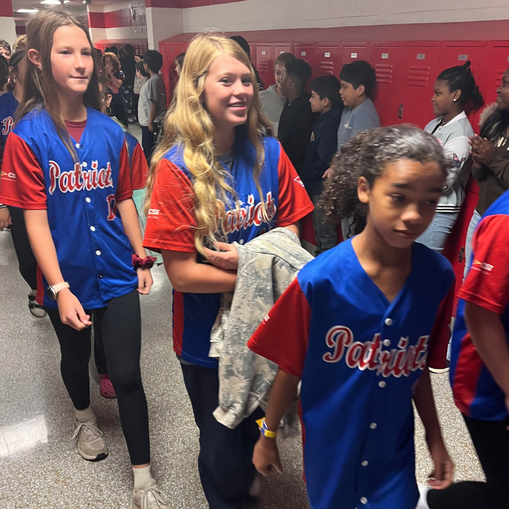 students in hallway during sports celebration