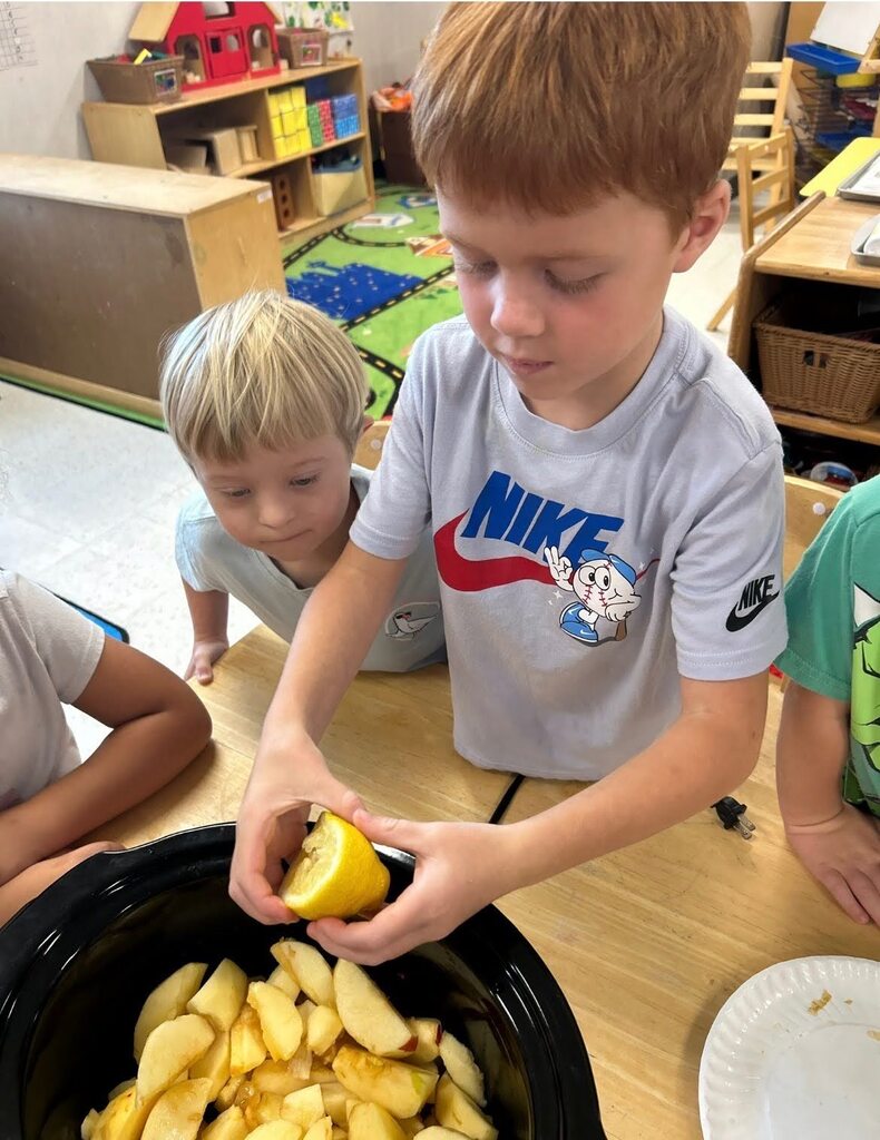 PreK students making homemade apple sauce