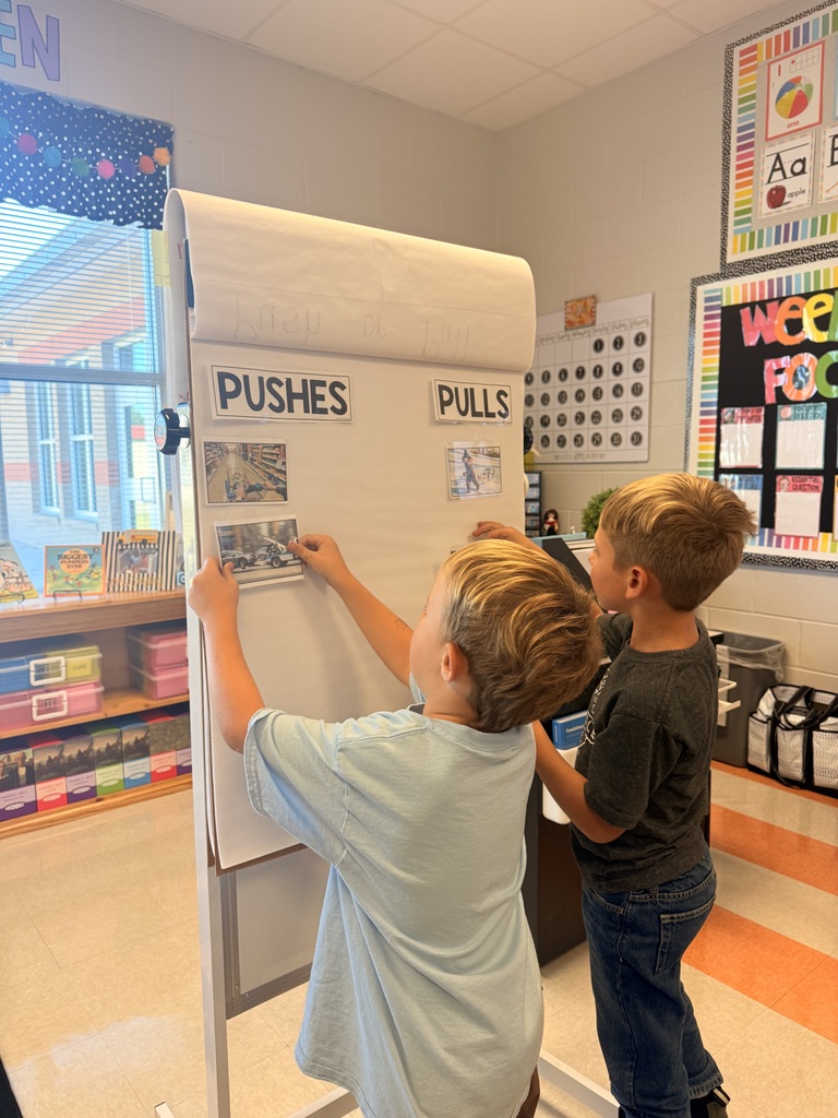 Kindergarten students working together in pairs