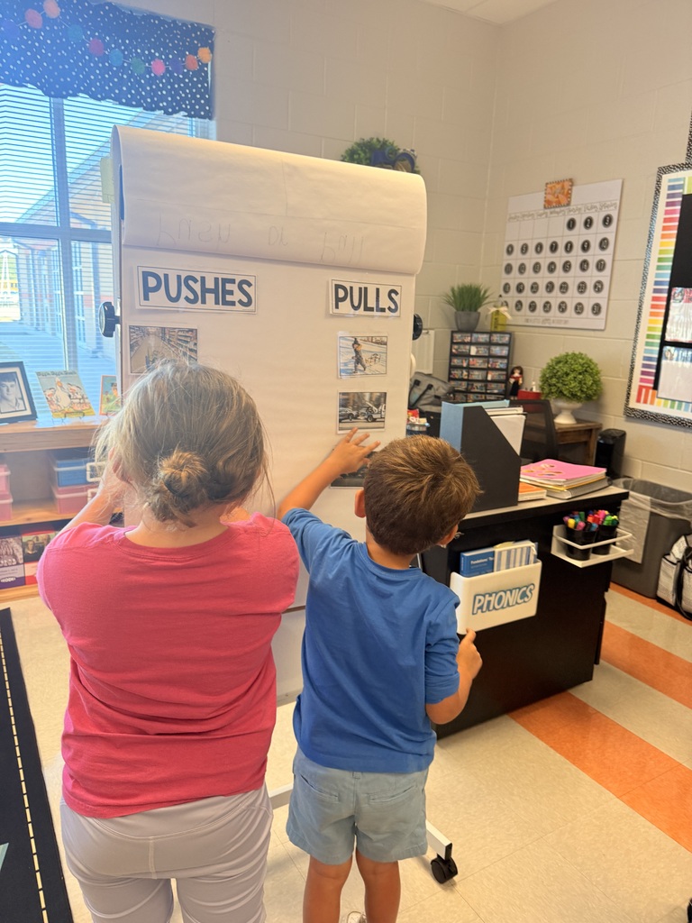 Kindergarten students working together in pairs