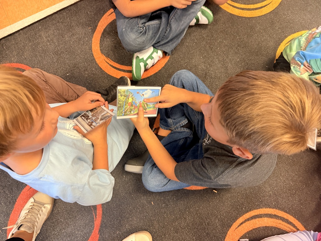 Kindergarten students working together in pairs