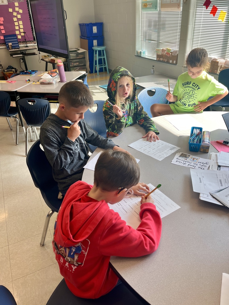 2nd grade students working on a vocabulary activity 