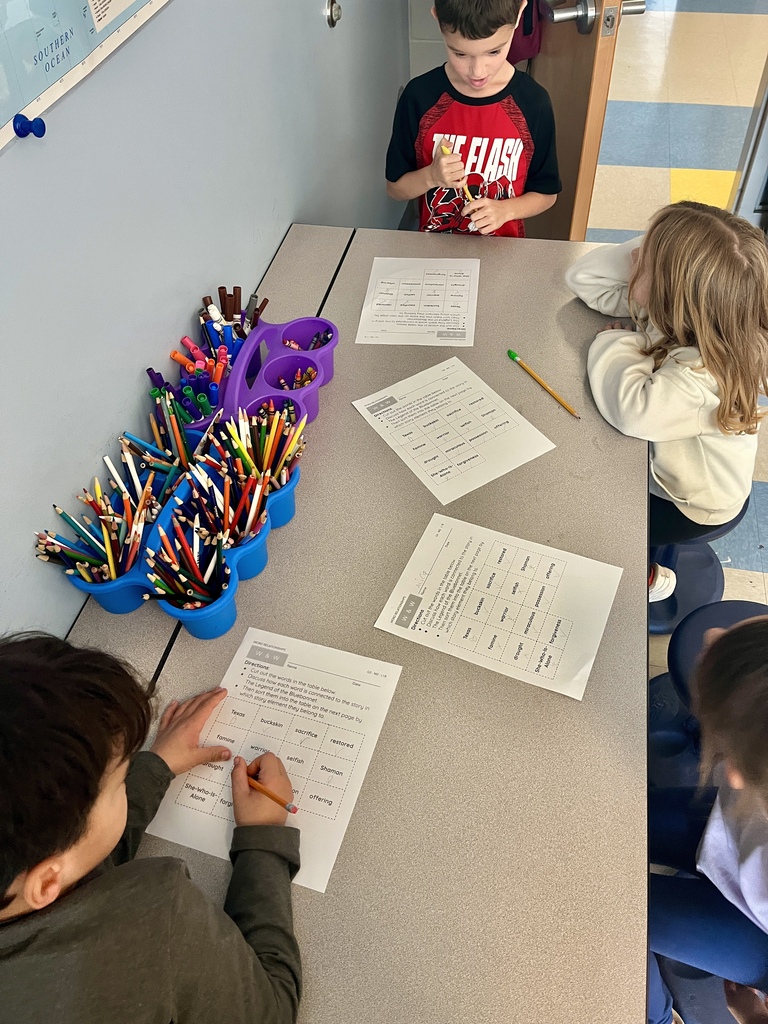 2nd grade students working on a vocabulary activity 