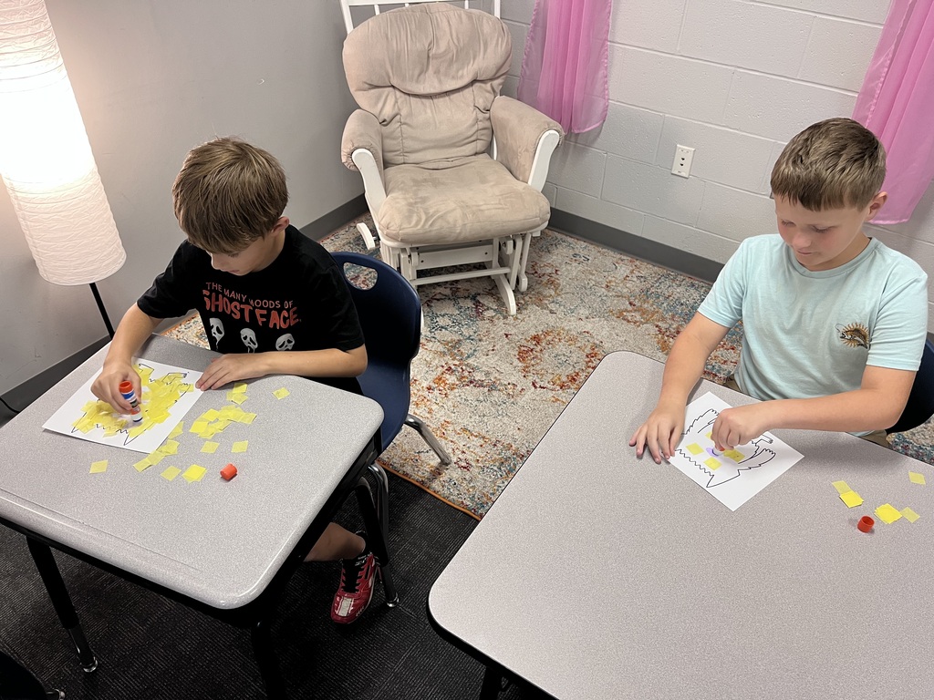 students working on a project at a table