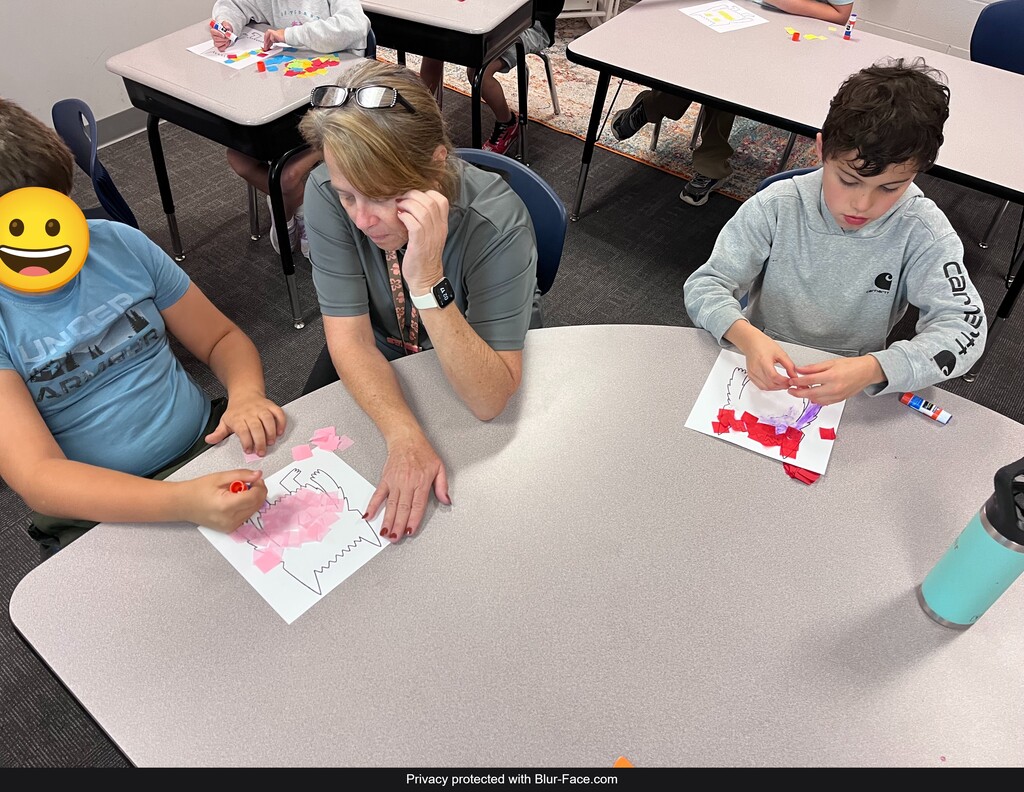 students working on a project at a table