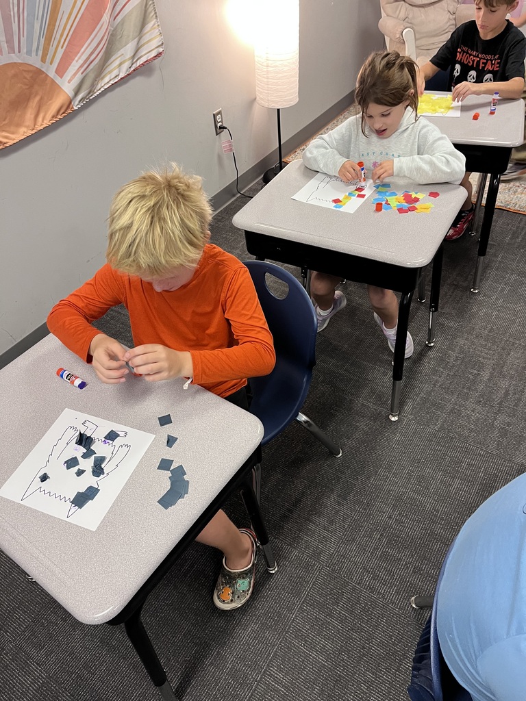 students working on a project at a table