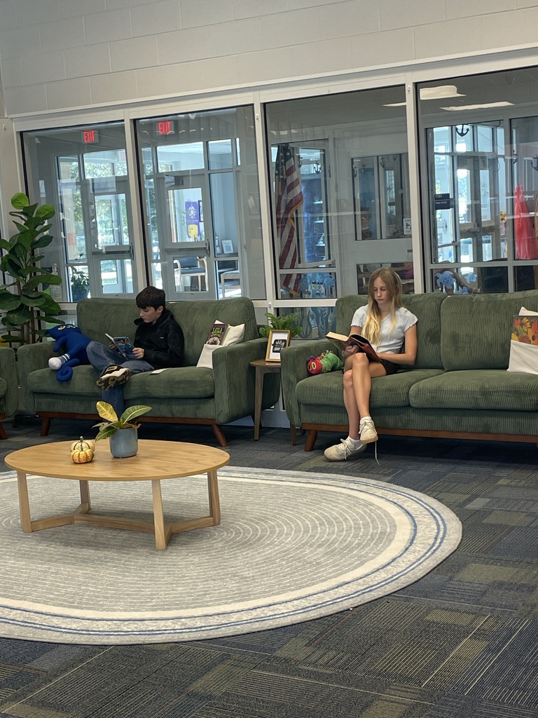 students reading in the library