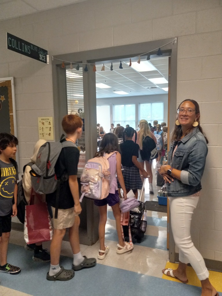 students walking into 5th grade classroom