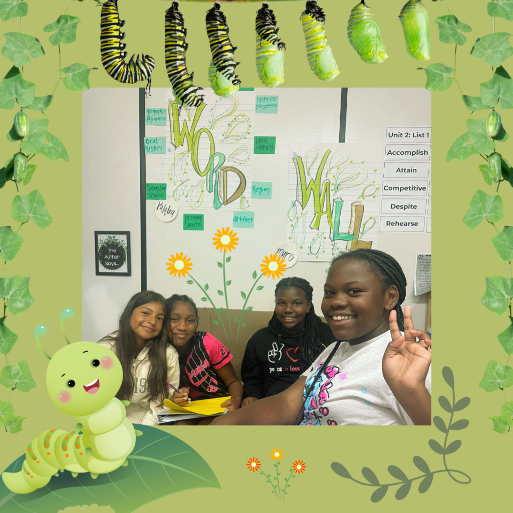 students posing with graphics in background