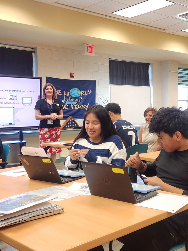 students at table reviewing presentation