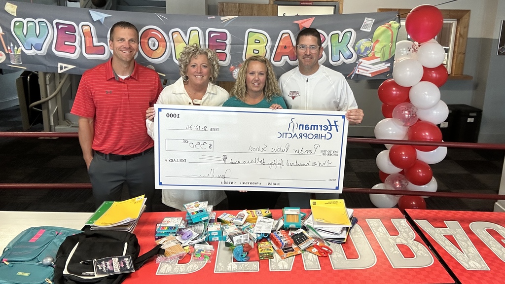 Herman Chiropractic with donations and donation check