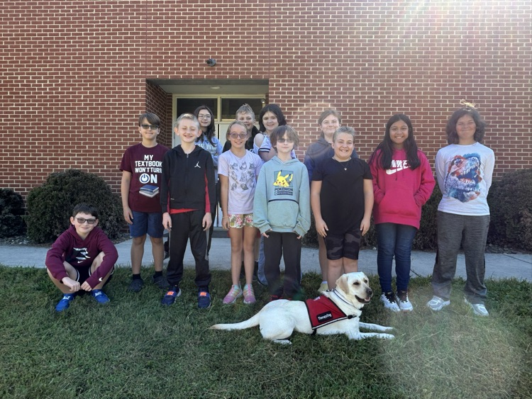 5th grade students with Penny the Therapy dog
