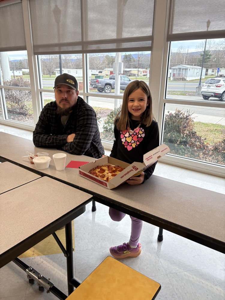 students and their guest making pizza