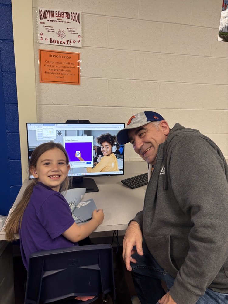 student and their guest reading a book