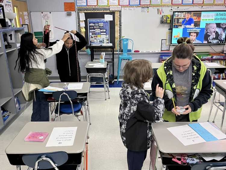 Students and Family members participating in an activity. 