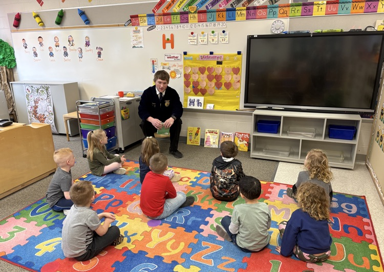 FFA student reading to a class. 