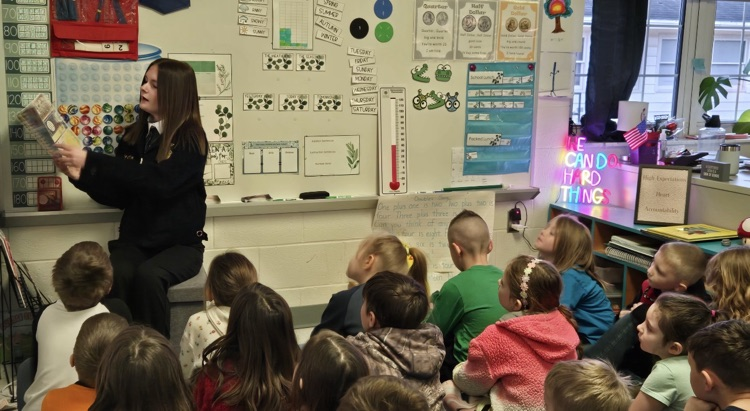 FFA student reading to a class. 