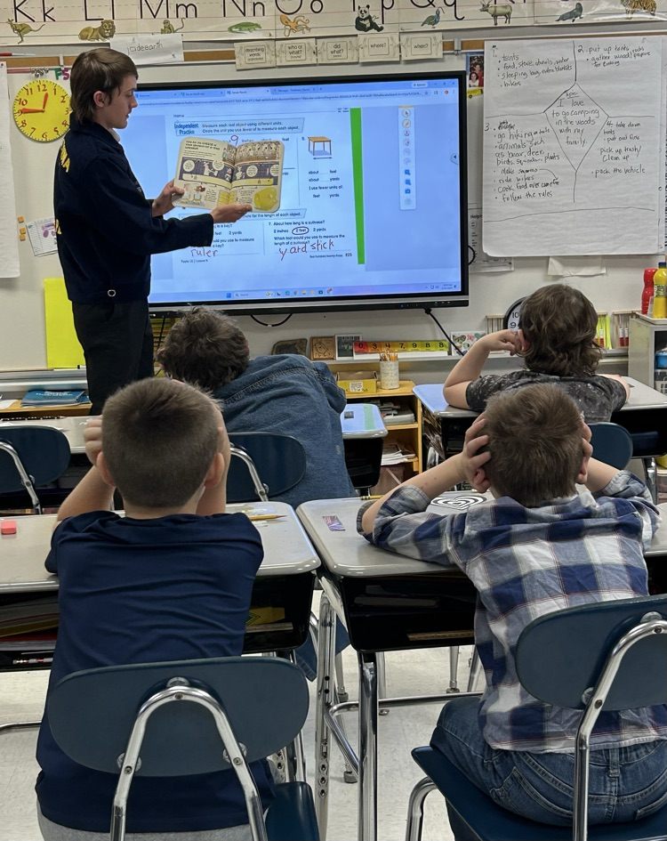 FFA student reading to a class. 