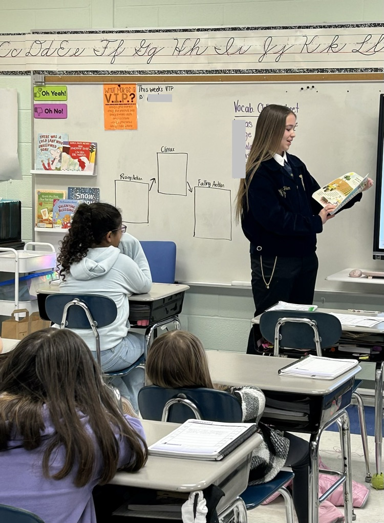 FFA student reading to a class. 