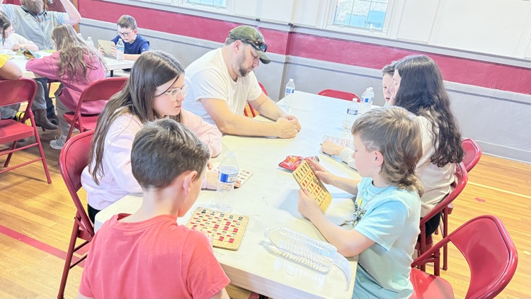 Families playing bingo for a prize! 