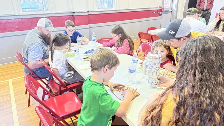 Families playing bingo for a prize! 
