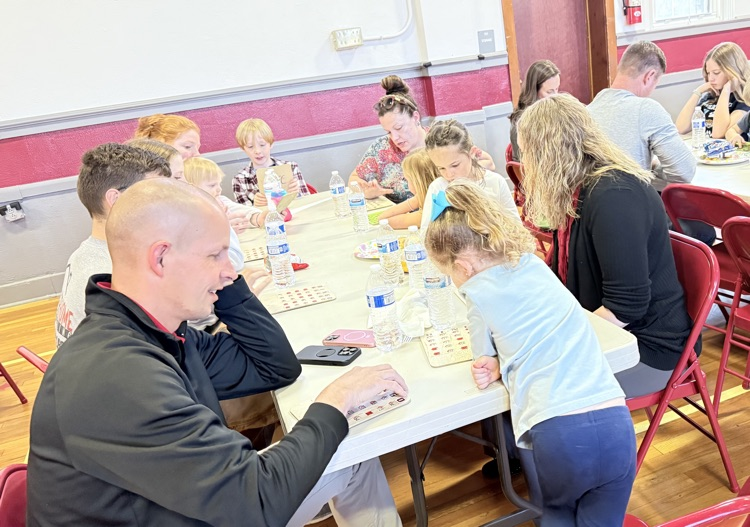 Families playing bingo for a prize! 