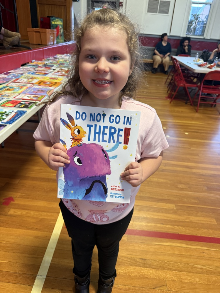 A winner and their book of choice! 