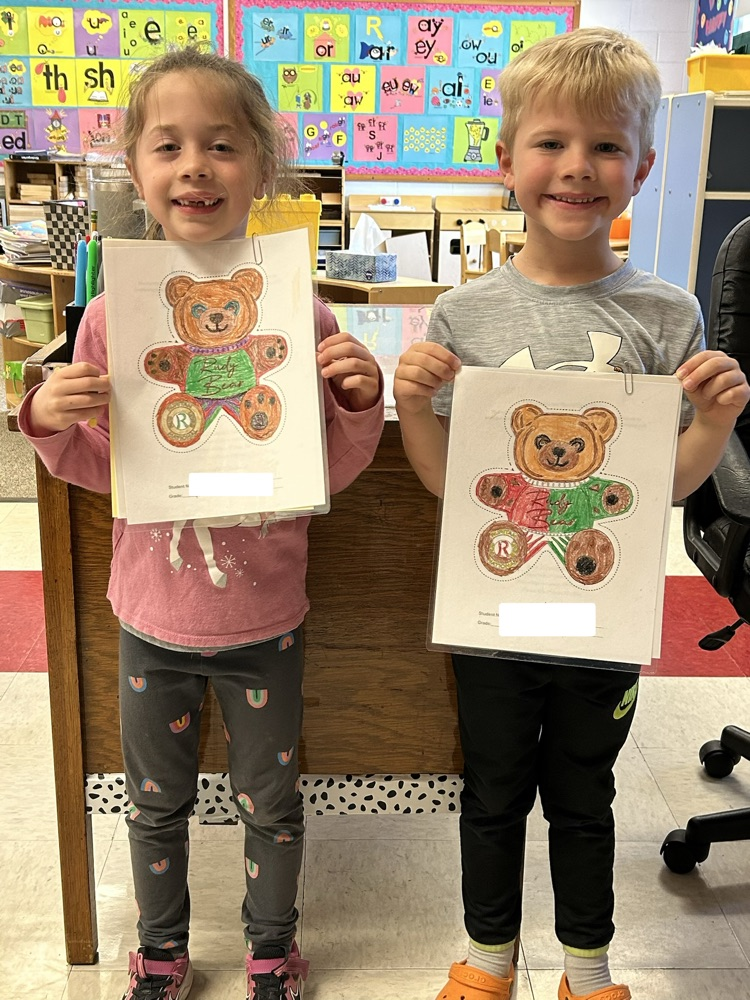Students standing with their coloring contest pictures! 