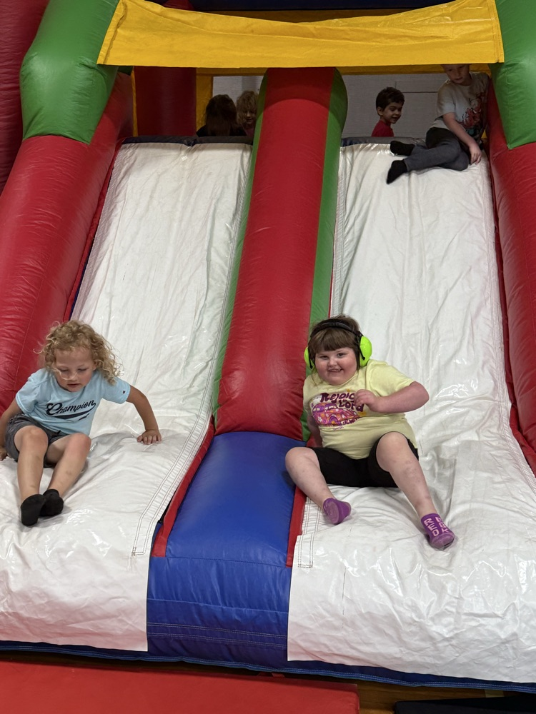 Students participating in the inflatable reward! 
