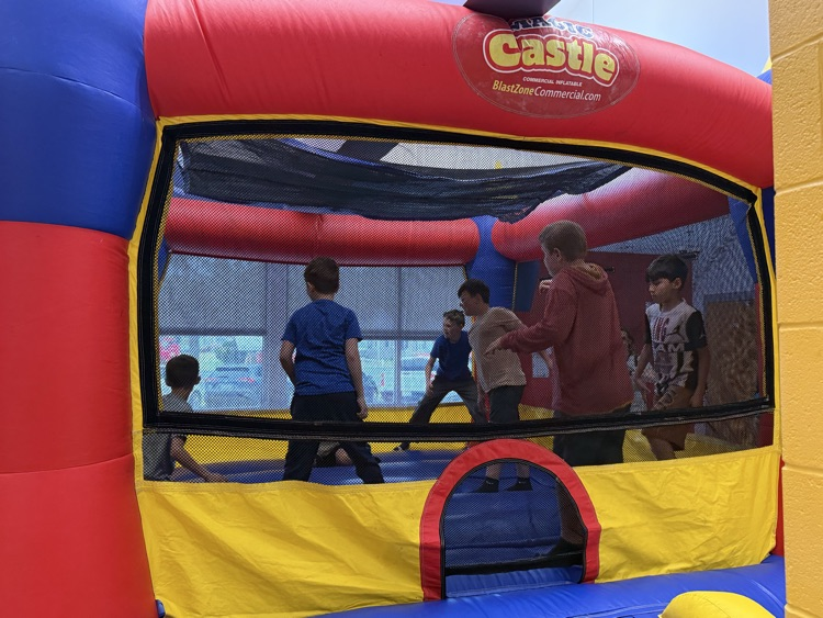Students participating in the inflatable reward! 