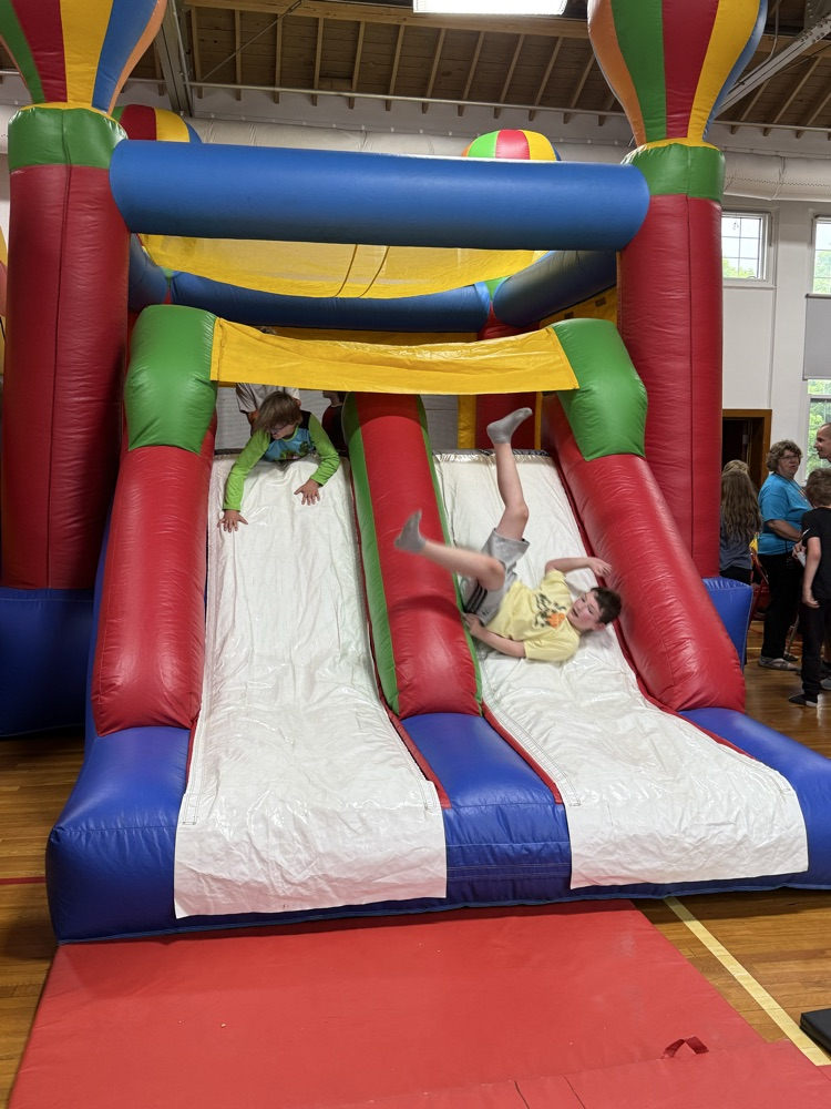 Students participating in the inflatable reward! 