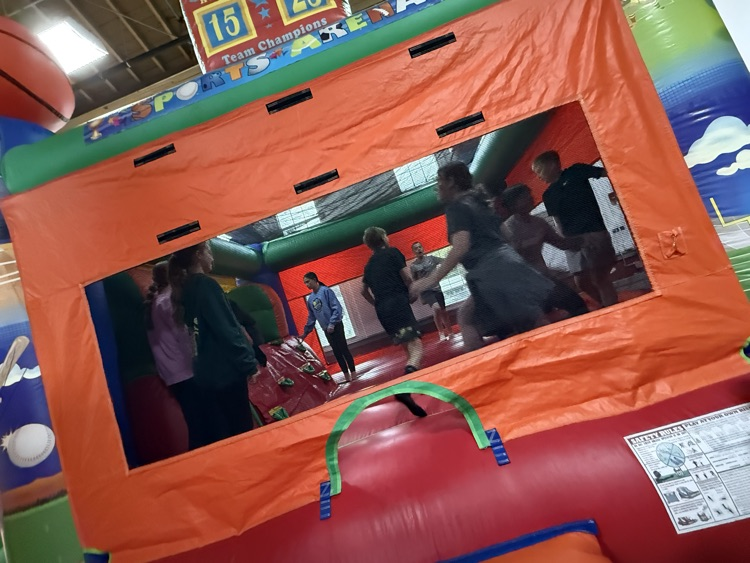 Students participating in the inflatable reward! 